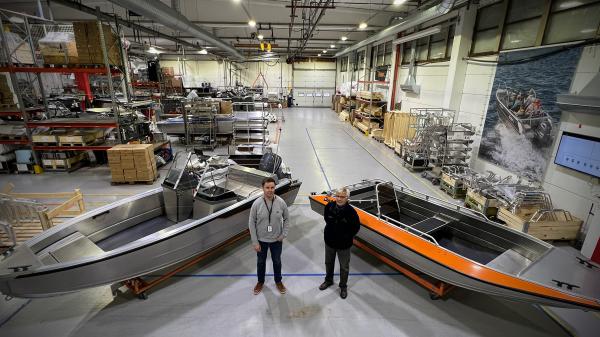 Boat designers Aleksi Juusti and Antti Hietaharju at the Inha Works with aluminium boats Buster M2 and Buster RS